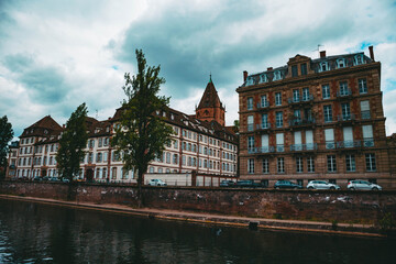 Naklejka premium Old architectural building in the city of Strasburg and river. Cityscape