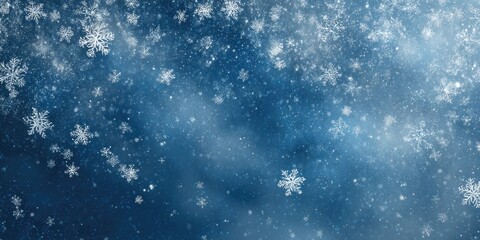 Fototapeta premium Falling snowflakes against a deep blue backdrop
