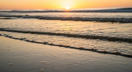 Obraz premium Golden hour shoreline at sunrise or sunset peaceful beach scene with waves and sand calm and tranquil coastal landscape photo