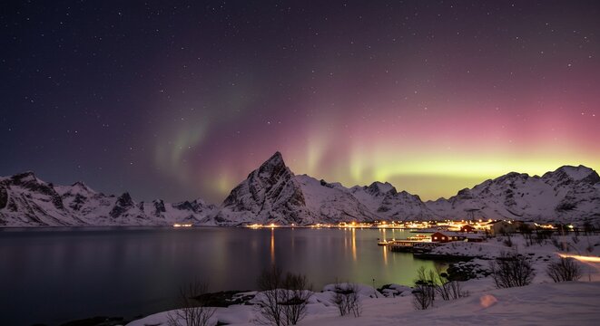 Vibrant Aurora Over Olstind Mountain and a Snowy Lofoten Fjord Village