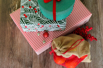 Top view of festive gift boxes and oranges
