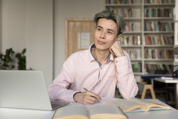 Learning inspiration. Dreamy gen z student take pause in remote studying relax from taking notes from paper online resources imagine successful professional start in future create ideas for assignment