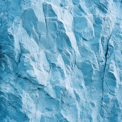 Close up of textured blue rock surface, showcasing intricate patterns and natural formations. cool tones and rugged texture evoke sense of calm and strength