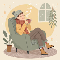 Woman relaxing in armchair with hot drink on a cozy winter day indoors