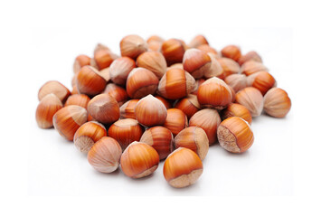 Pile of hazelnuts on a white background