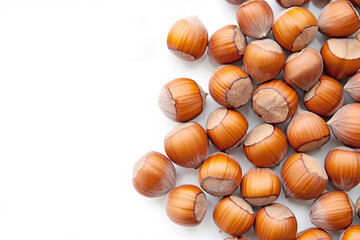 Pile of hazelnuts on a white background
