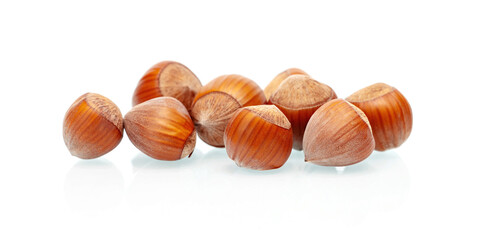 Pile of hazelnuts on a white background