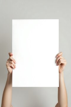 Human Hands Holding a Large Blank White Poster
