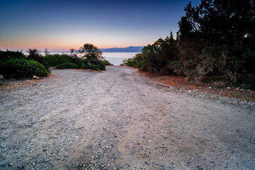 Gravel road leading towards the Sea. The world on the island of Cyprus, Neo Chorio, Akamas...