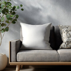 Blank pillow on a modern sofa scene with neutral tones