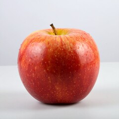 Single red and yellow apple, wet