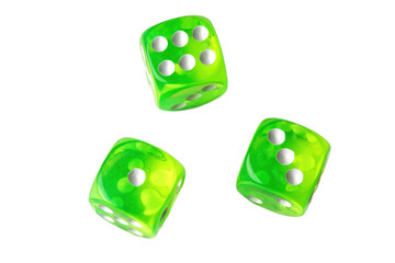 A random arrangement of green dice and a puzzle cup, captured after the dice have been cast.
