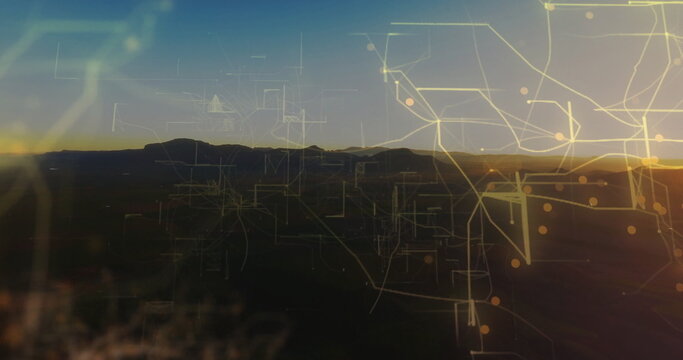 Featuring dark mountain silhouette stretching across dawn sky, with digital network overlay - Powered by Adobe
