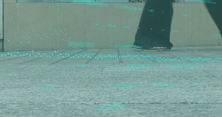 Striding feet in wide trousers, black athletic shoes across paving at plaza, with cyan data overlay