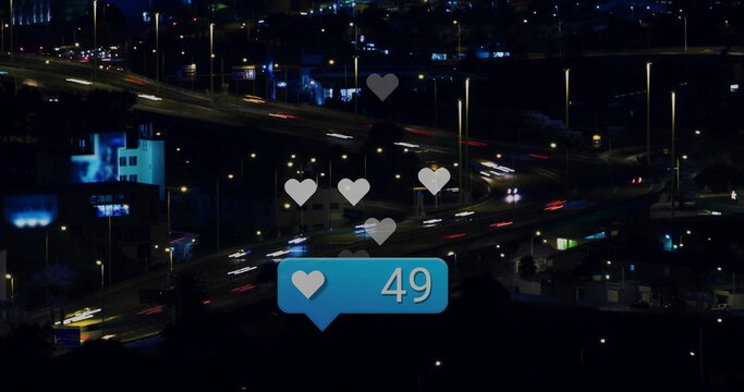 Floating blue notification icon showing white heart 49 above night highway ramps, with light trails - Powered by Adobe