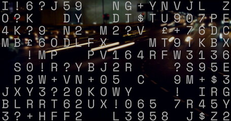 Displaying random white alphanumeric text overlaying night city highway, with blurred light trails