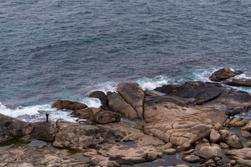 high angle view of the rocky beach with breaking waves