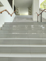 Capturing a scenic drive down a wide boulevard lined with lush green palm trees under a bright blue sky.