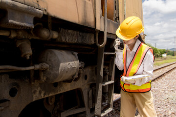 Asian young teen engineer worker work in Train station, Old locomotive service maintenance