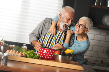 Happy senior cooking together