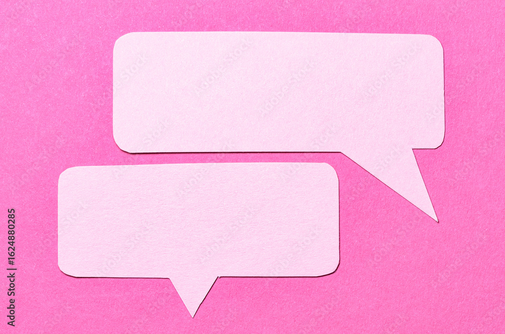 Poster blank cut out paper speech bubbles with copy space for text on pink background, flat lay top view co