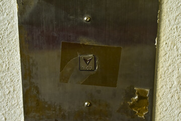 Close-up of the lift down button. Elevator button.