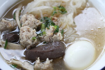 Delicious Kuay Chap with egg in a bowl