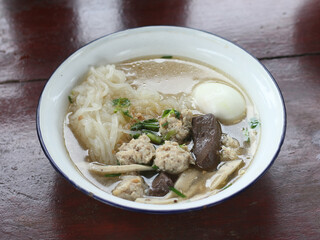Delicious Kuay Chap with egg in a bowl