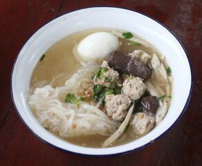 Delicious Kuay Chap with egg in a bowl