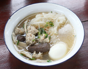 Delicious Kuay Chap with egg in a bowl