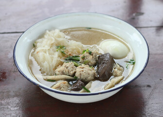 Delicious Kuay Chap with egg in a bowl