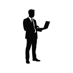 Silhouette of a businessman standing and holding a laptop