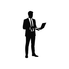 Silhouette of a businessman holding a laptop computer