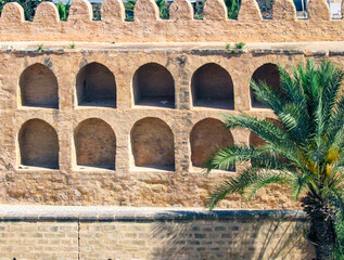 Small niches line the outer wall of Sousse’s Ribat — practical storage turned visual rhythm....