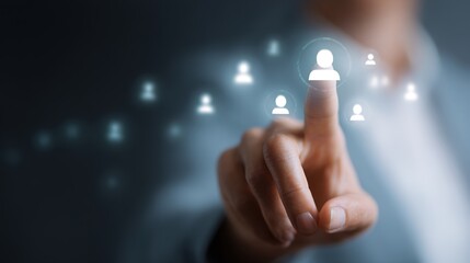 Human interaction with technology: A close-up shot of a finger pressing a digital person icon, highlighting the essence of recruitment, human resources.