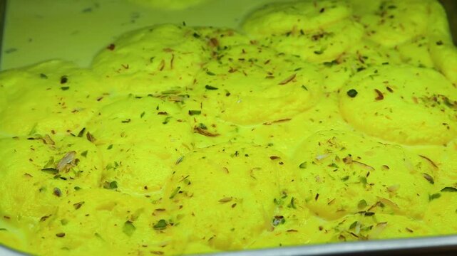 Ras malai an indian sweet dish garnished with pistachios 