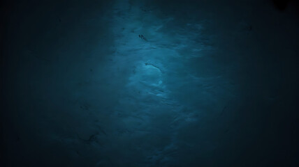 Abstract textured background with swirling patterns of deep blue and turquoise hues creating a cosmic or ethereal effect