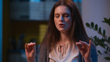 Stressed angry woman deep breathe meditate calm down panic stress relief at night tranquil girl Caucasian female breathing anxiety meditation close eyes at home night relax meditating health practice