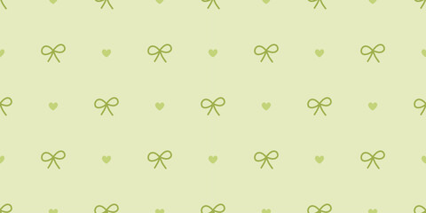 Seamless bow and heart pattern in pastel green