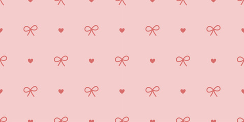 Seamless bow and heart pattern in pastel red