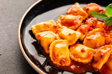 Ravioli beef tomato sauce second course fresh delicious gourmet food background on the table rustic...