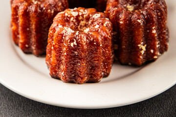 Canneles sweet dessert french cuisine sweets fresh delicious gourmet food background on the table rustic food top view copy space
