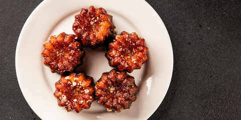 Canneles sweet dessert french cuisine sweets fresh delicious gourmet food background on the table rustic food top view copy space
