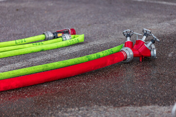 Fire Hose Splitter on Wet Asphalt