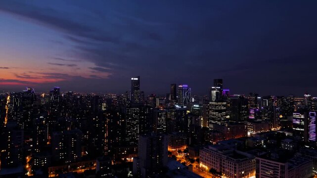 Dusk city skyline aglow with lights