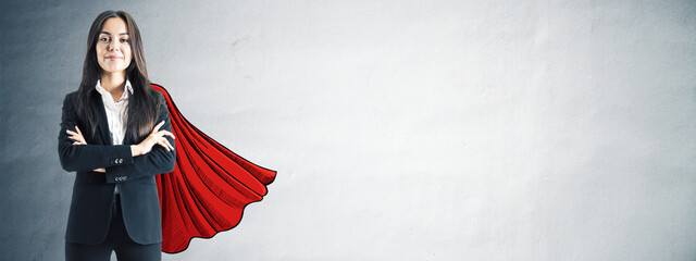 Confident businesswoman in black suit with red superhero cape sketched behind, standing strong...