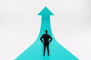 Businessman standing on upward arrow path symbolizing career growth and leadership vision for...