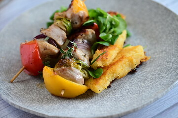 Colorful grilled chicken skewer with vibrant vegetables as a delicious food background. 