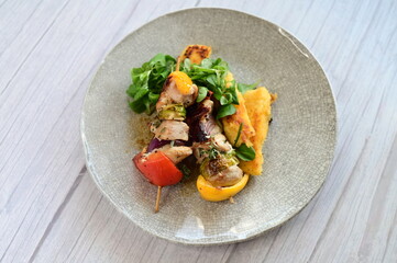 Colorful grilled chicken skewer with vibrant vegetables as a delicious food background. 