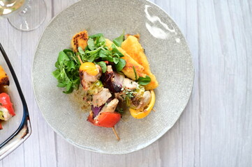 Colorful grilled chicken skewer with vibrant vegetables as a delicious food background. 